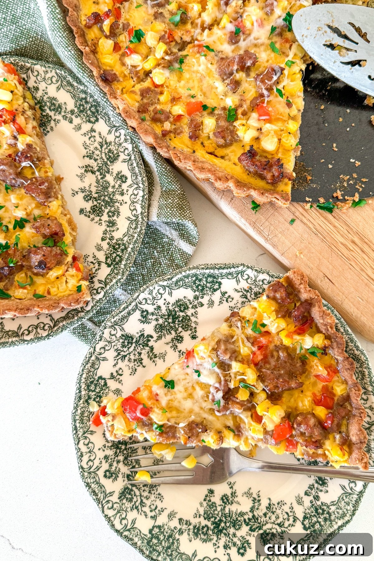 Sausage and Corn Pie with Quick Press‑In Pan Crust 10 slices of sausage pie on green floral plates