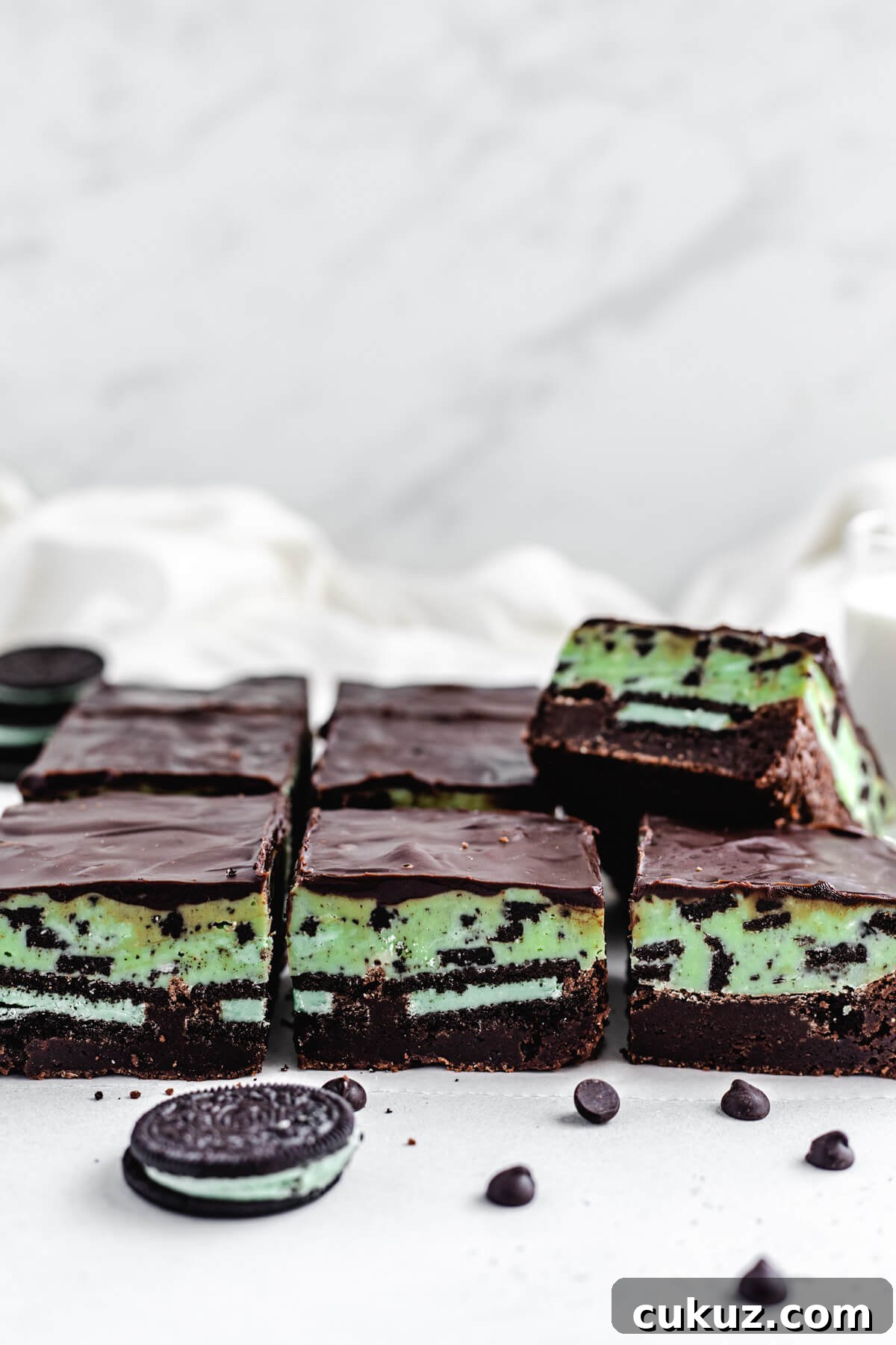row of brownies topped with fudge