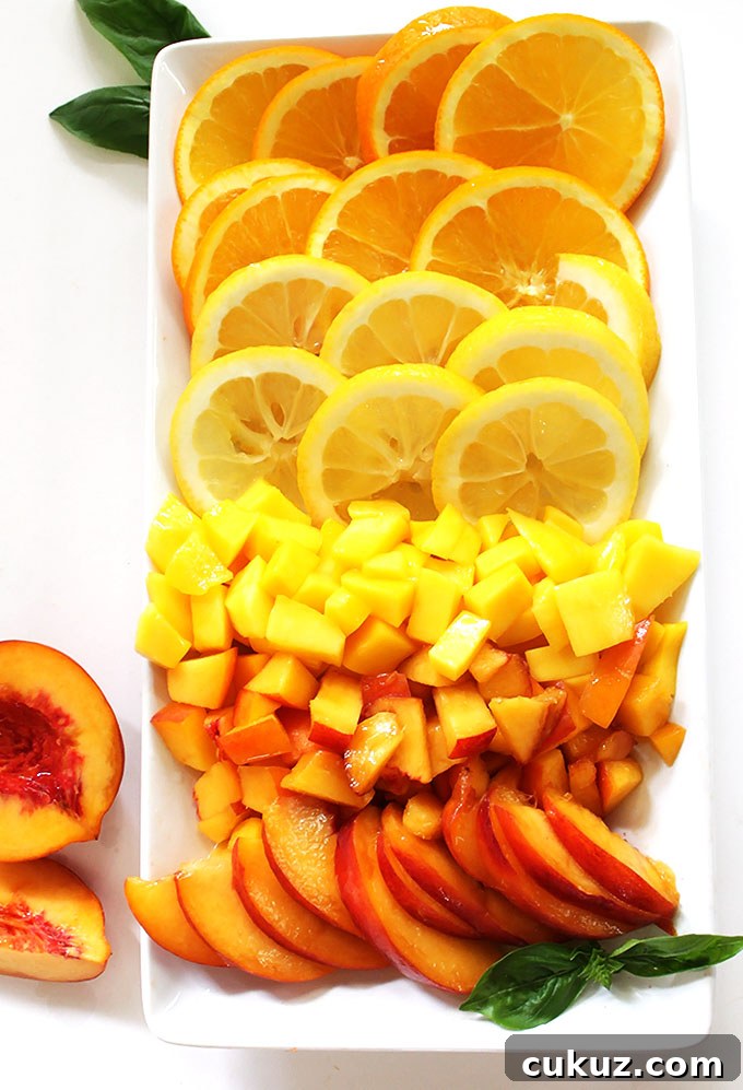 Peach Mango Sangria. Filled to the brim with peaches and mango. Fruity and refreshing. #sangria #summercocktail #refinedsugarfree | robustrecipes.com