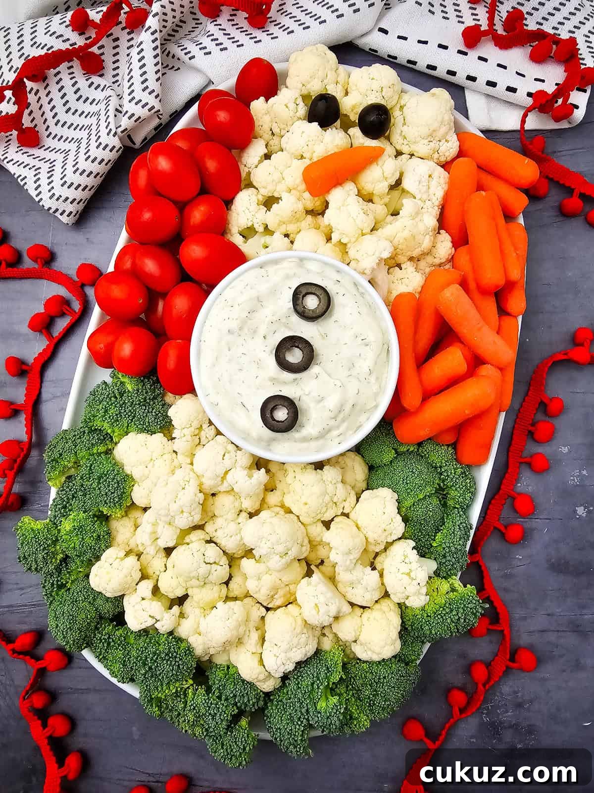 Snowman Veggie Platter with red ribbon