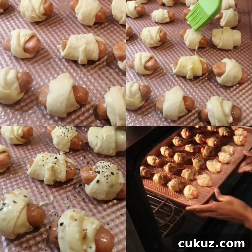 Everything bagel pigs in a blanket before baking.