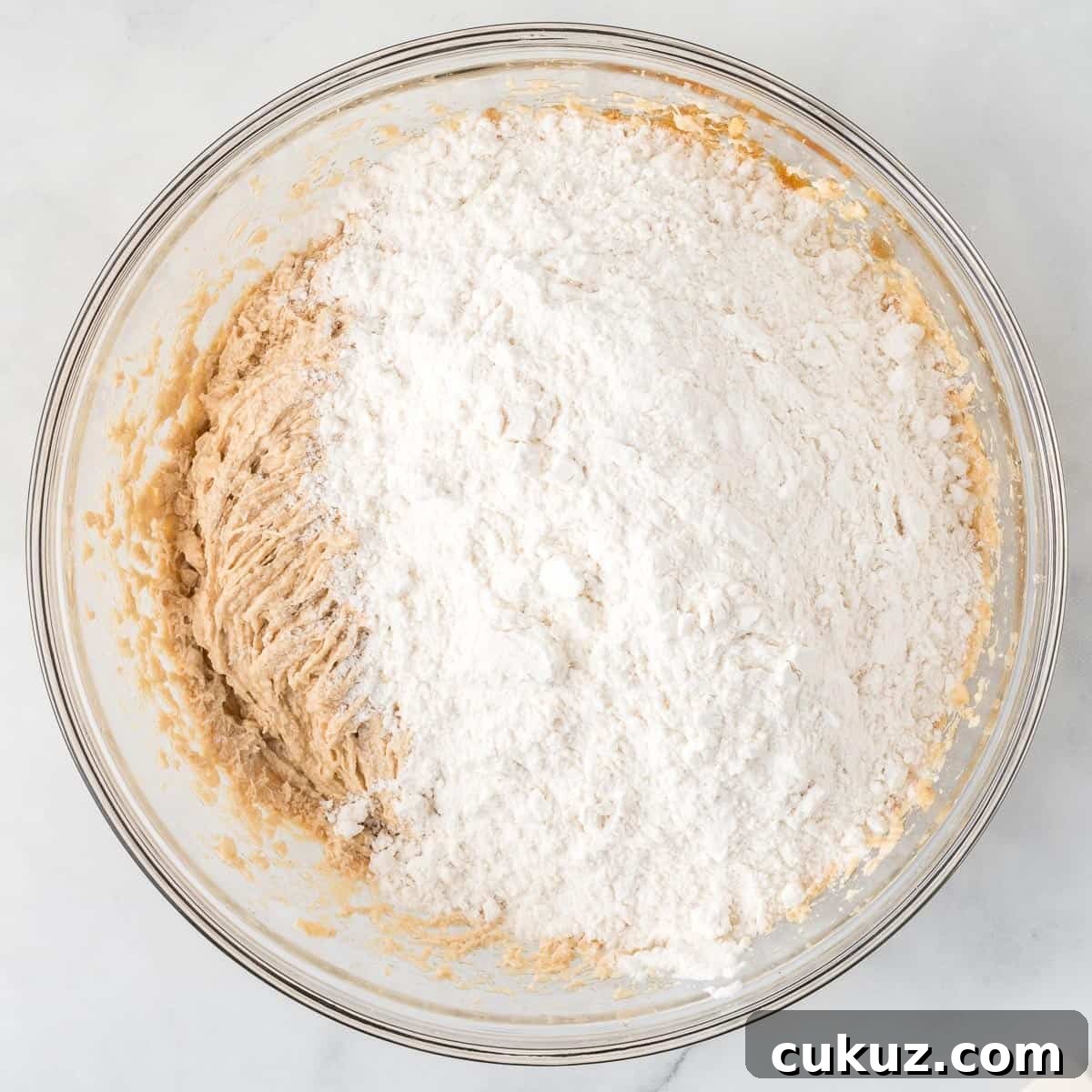 adding the dry ingredients to the wet ingredients