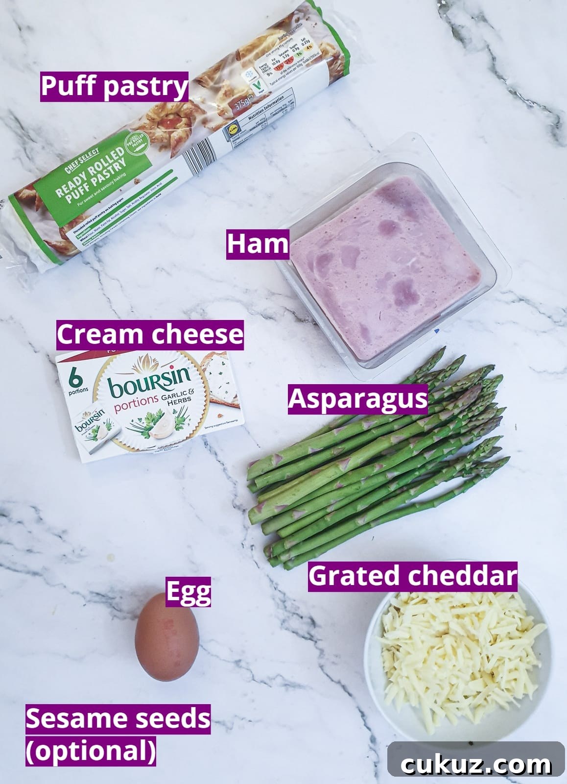 Ingredients for puff pastry asparagus and ham wraps with cheese.