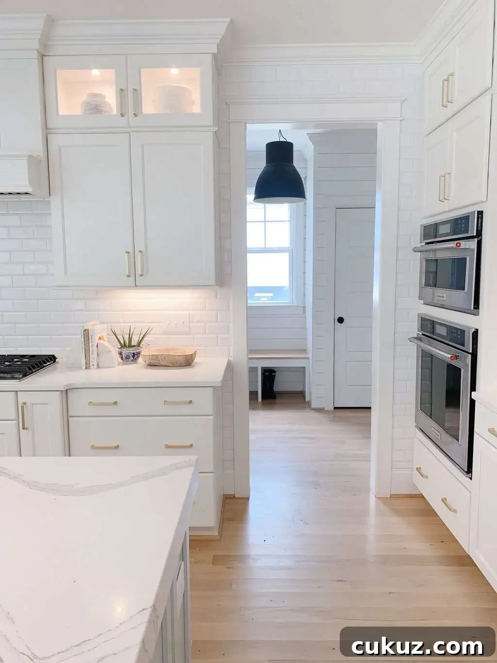 White Oak Flooring Guide: Selection, Installation & Care 5 subway tile in a blue and white kitchen