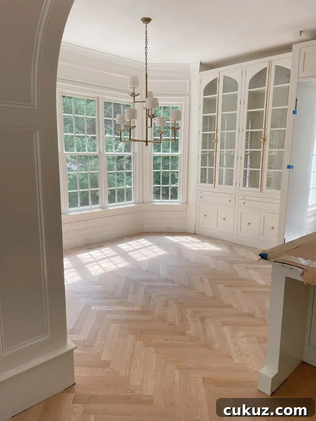 White Oak Flooring Guide: Selection, Installation & Care 8 white oak herringbone in a kitchen