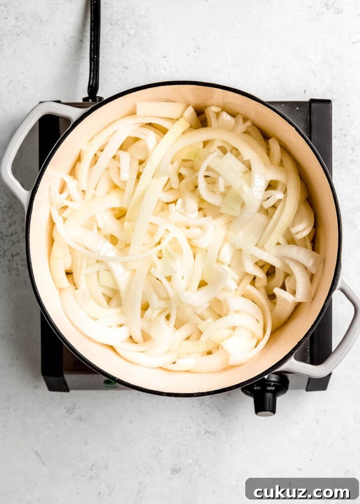 3 pounds of onions sliced and tossed in melted butter in a large pot