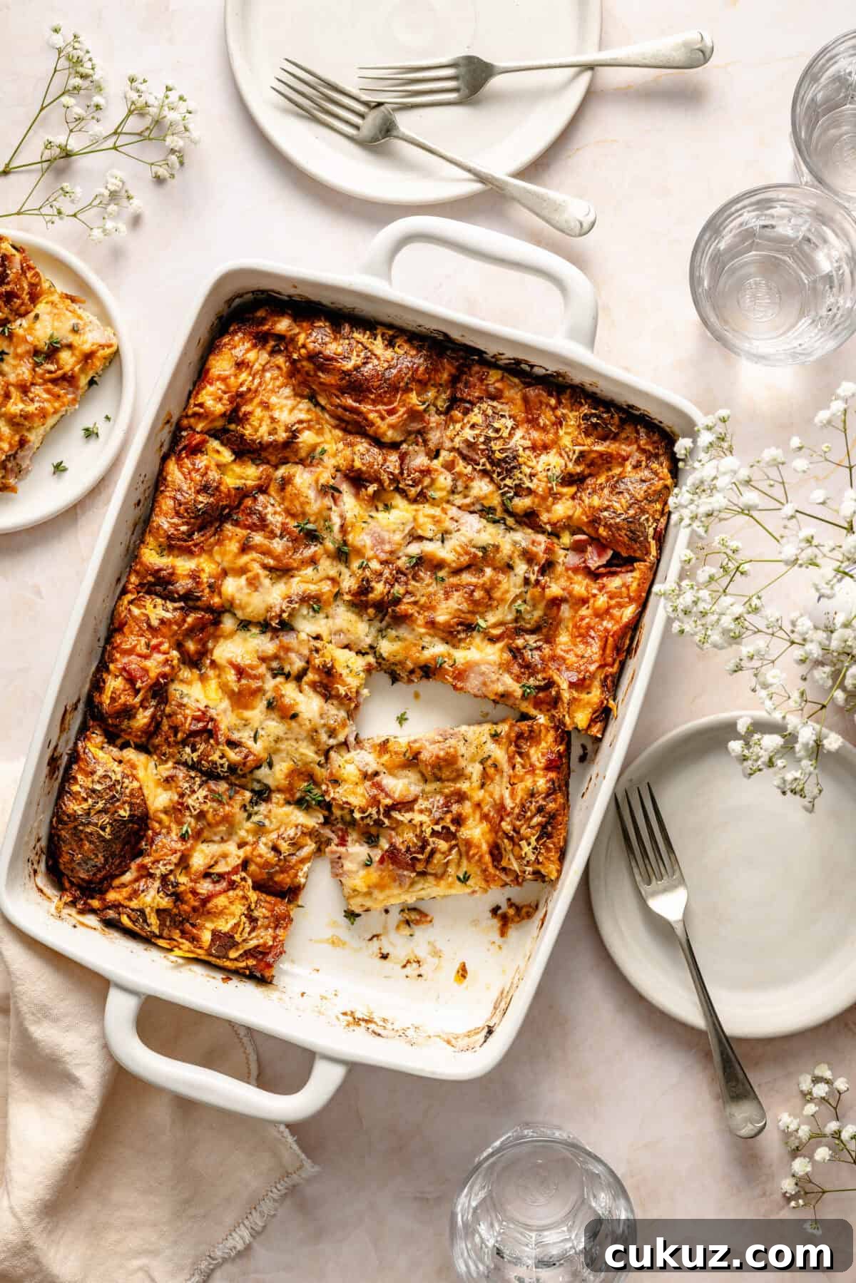 Croque Monsieur Breakfast Casserole sliced in baking dish.