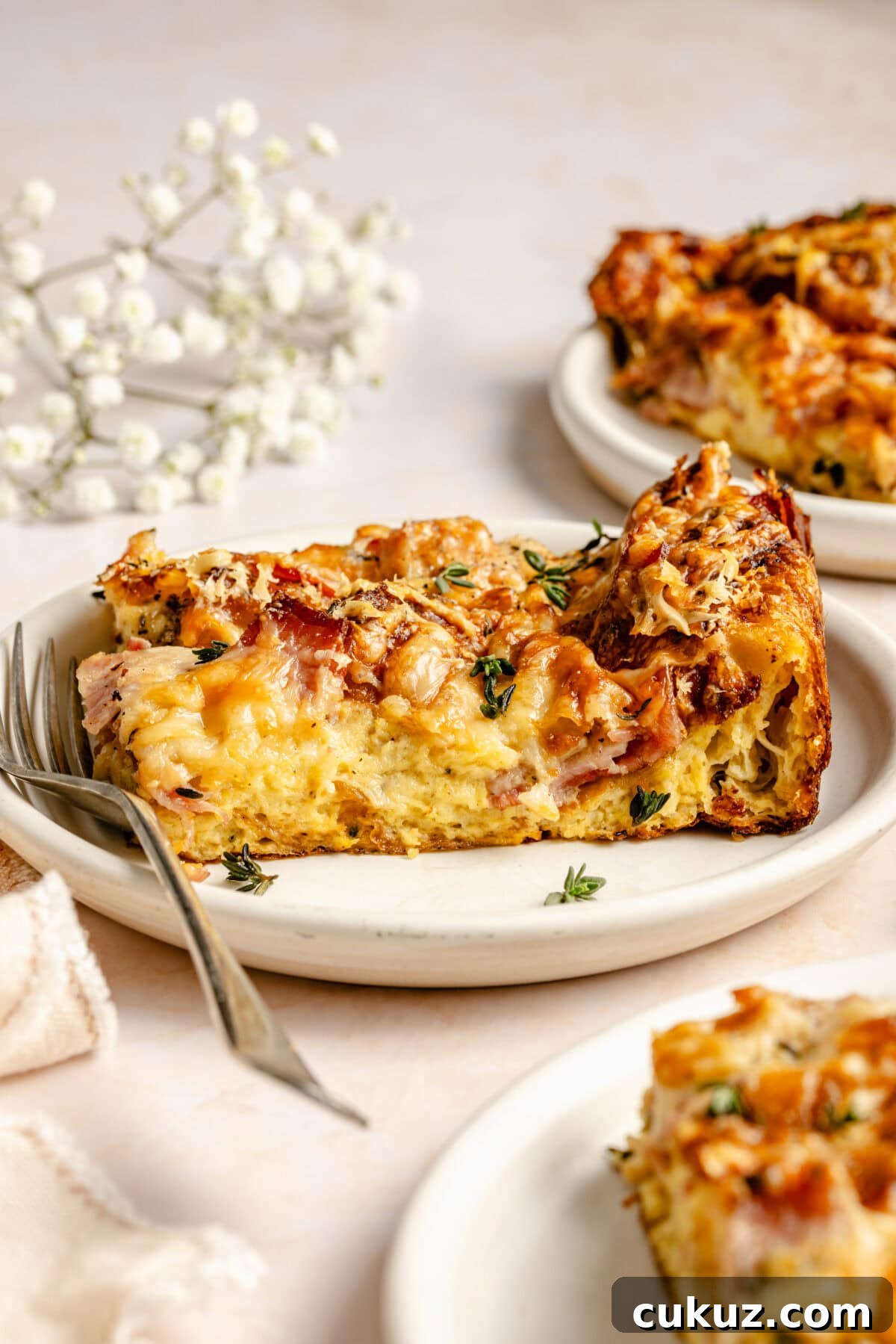Croque Monsieur Breakfast Casserole slice on a plate.