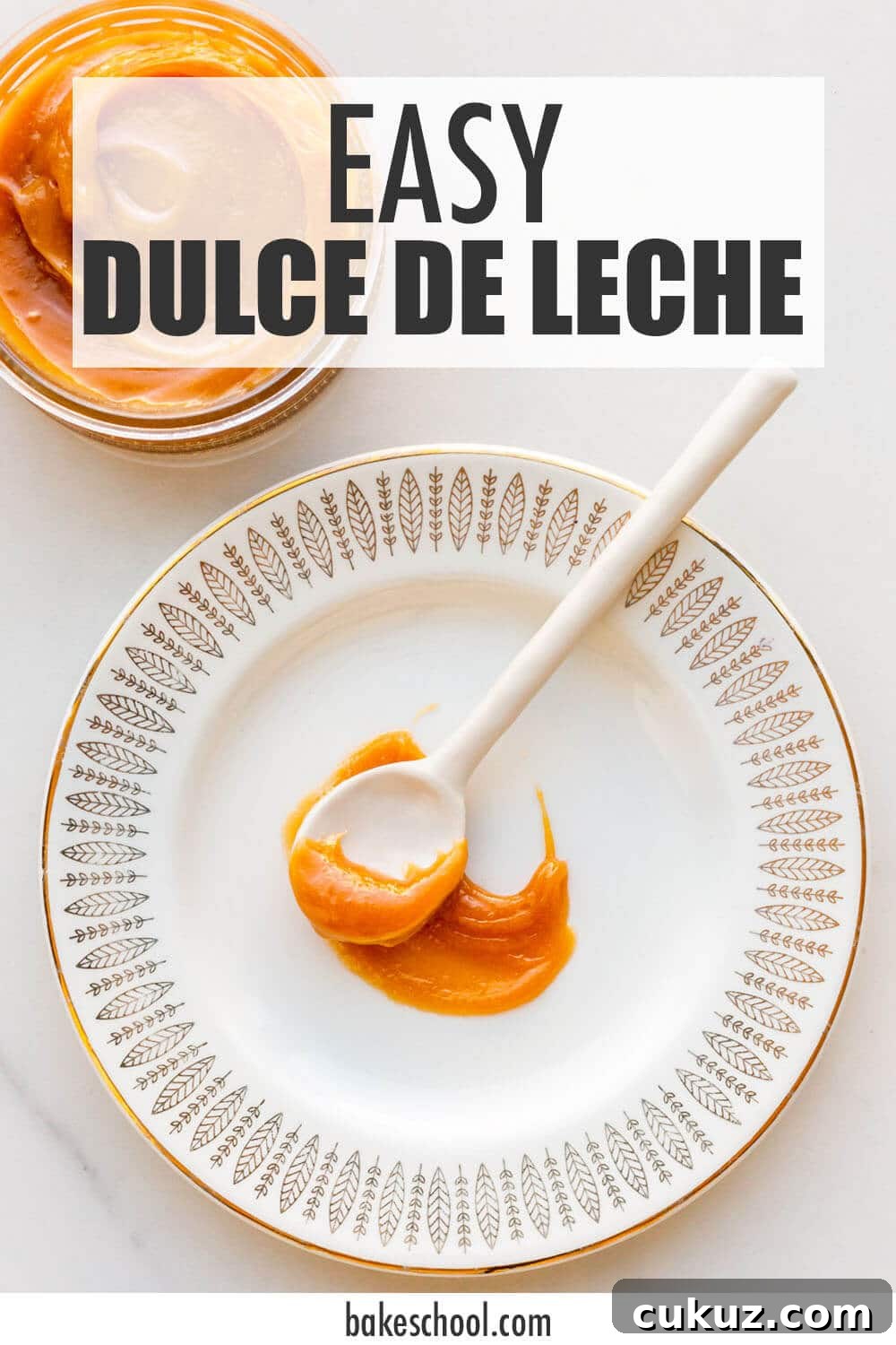 A spoonful of thick, gooey dulce de leche on a plate.