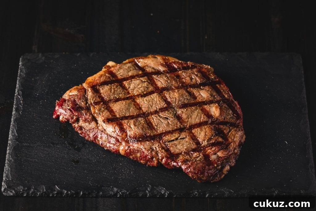 Pellet grilled steak on a serving platter.
