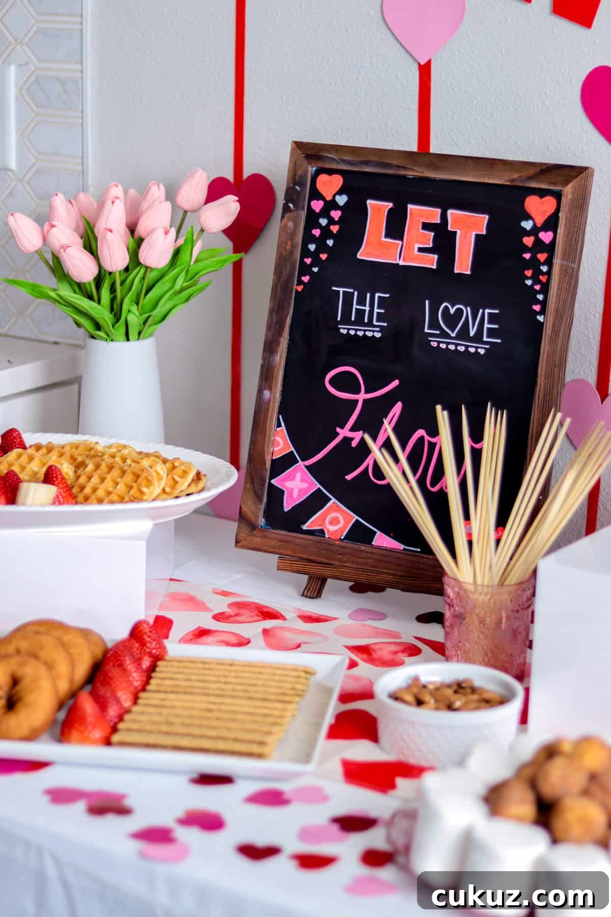 Chocolate bar chalkboard sign with dipping options on table.