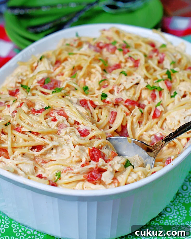 easy rotel chicken spaghetti casserole is a creamy, cheesy family comfort meal