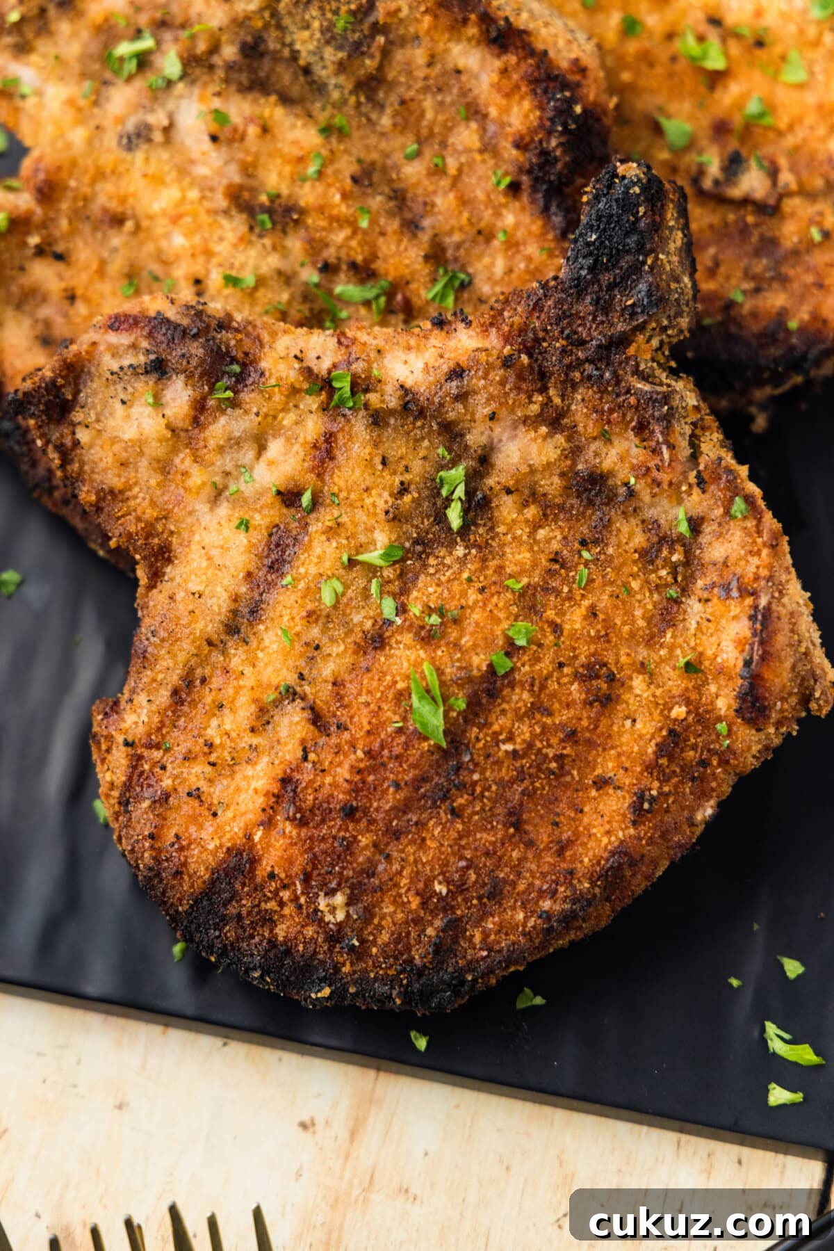 Crispy Grilled Breaded Pork Chops Recipe 2 Grilled Breaded Pork Chops on platter