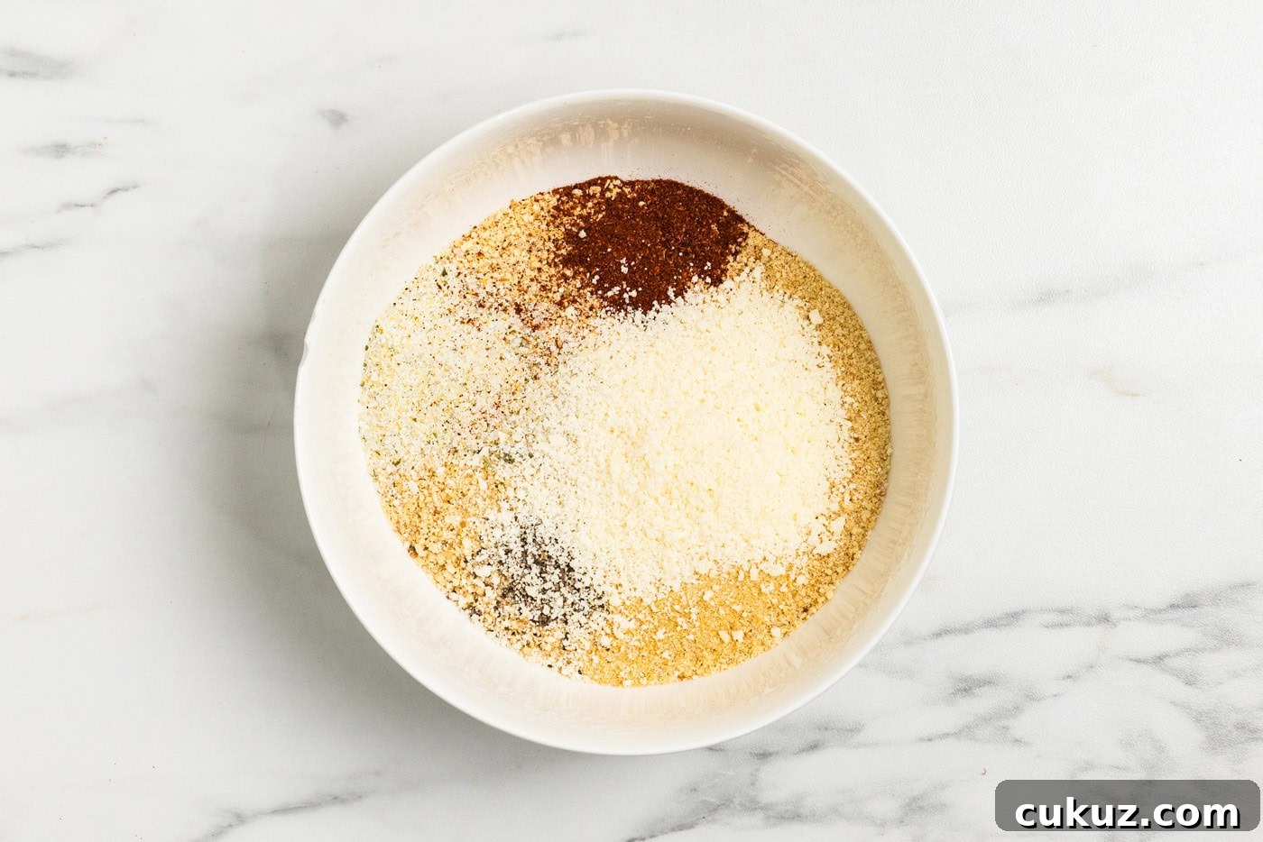 Crispy Grilled Breaded Pork Chops Recipe 5 bread crumbs and other dry ingredients in bowl