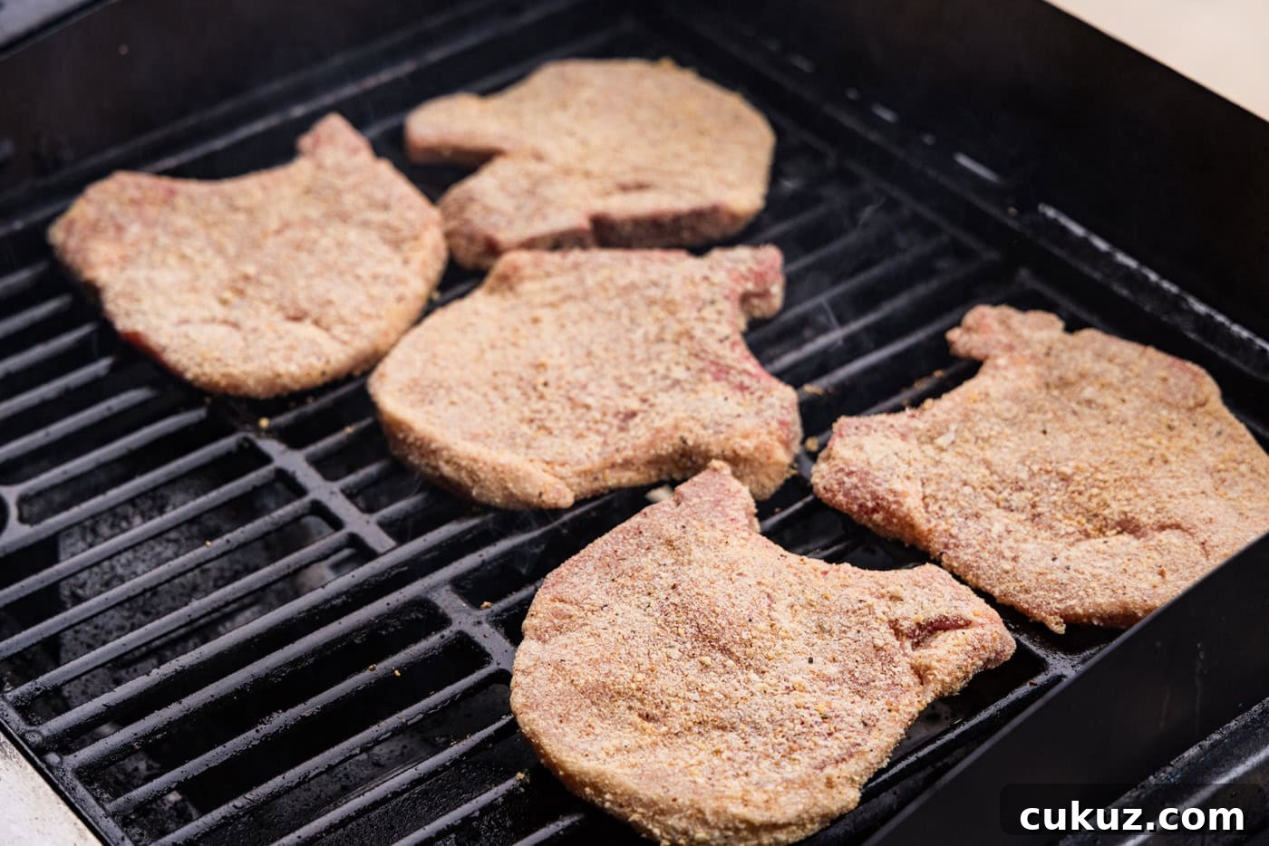 Crispy Grilled Breaded Pork Chops Recipe 9 breaded raw pork chops on grill