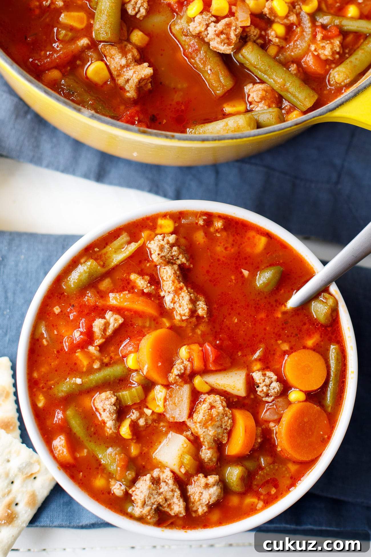 ground turkey soup in a bowl with crackers