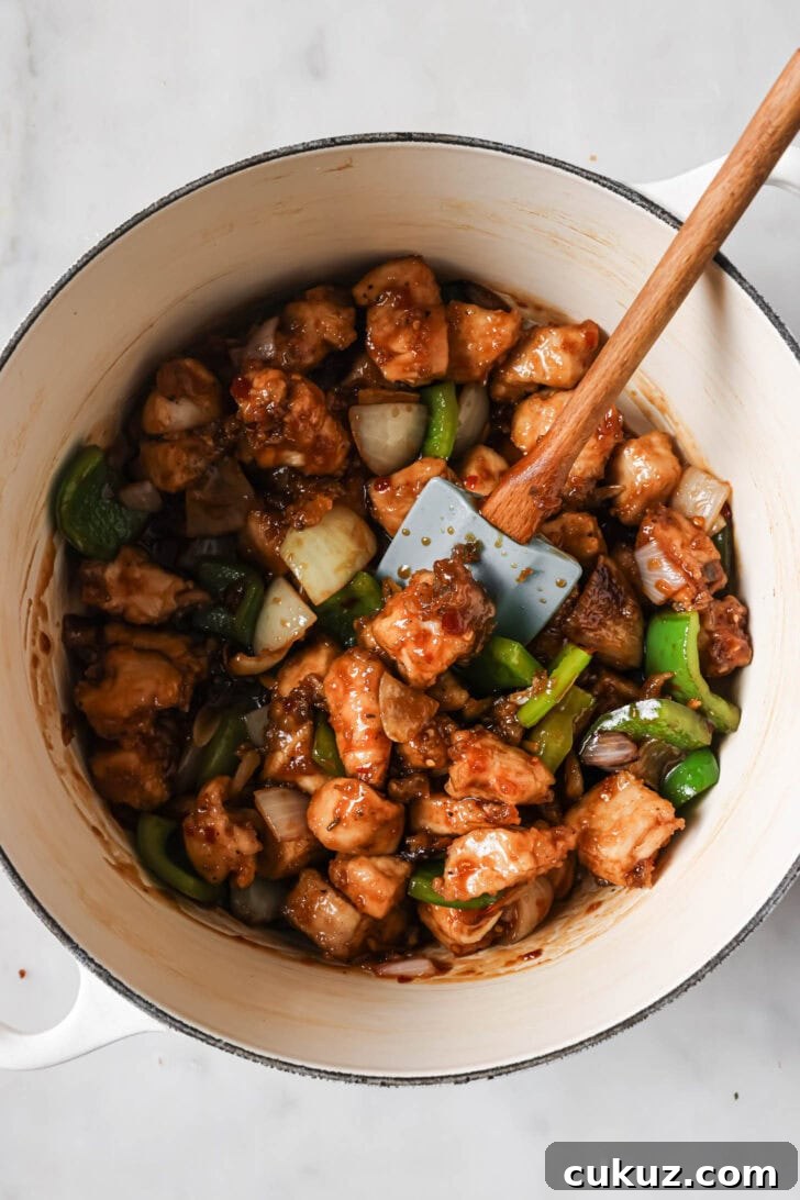 Fried chicken added to stir fry vegetables and sauce.