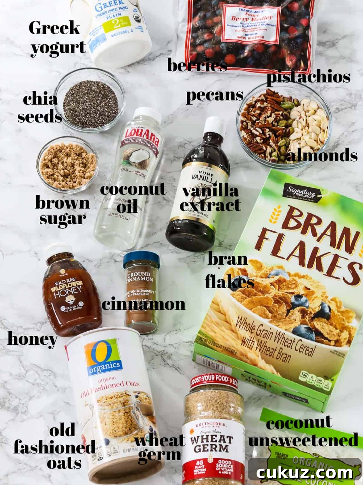 Ingredients labeled to make yogurt parfaits with a granola recipe on a table.