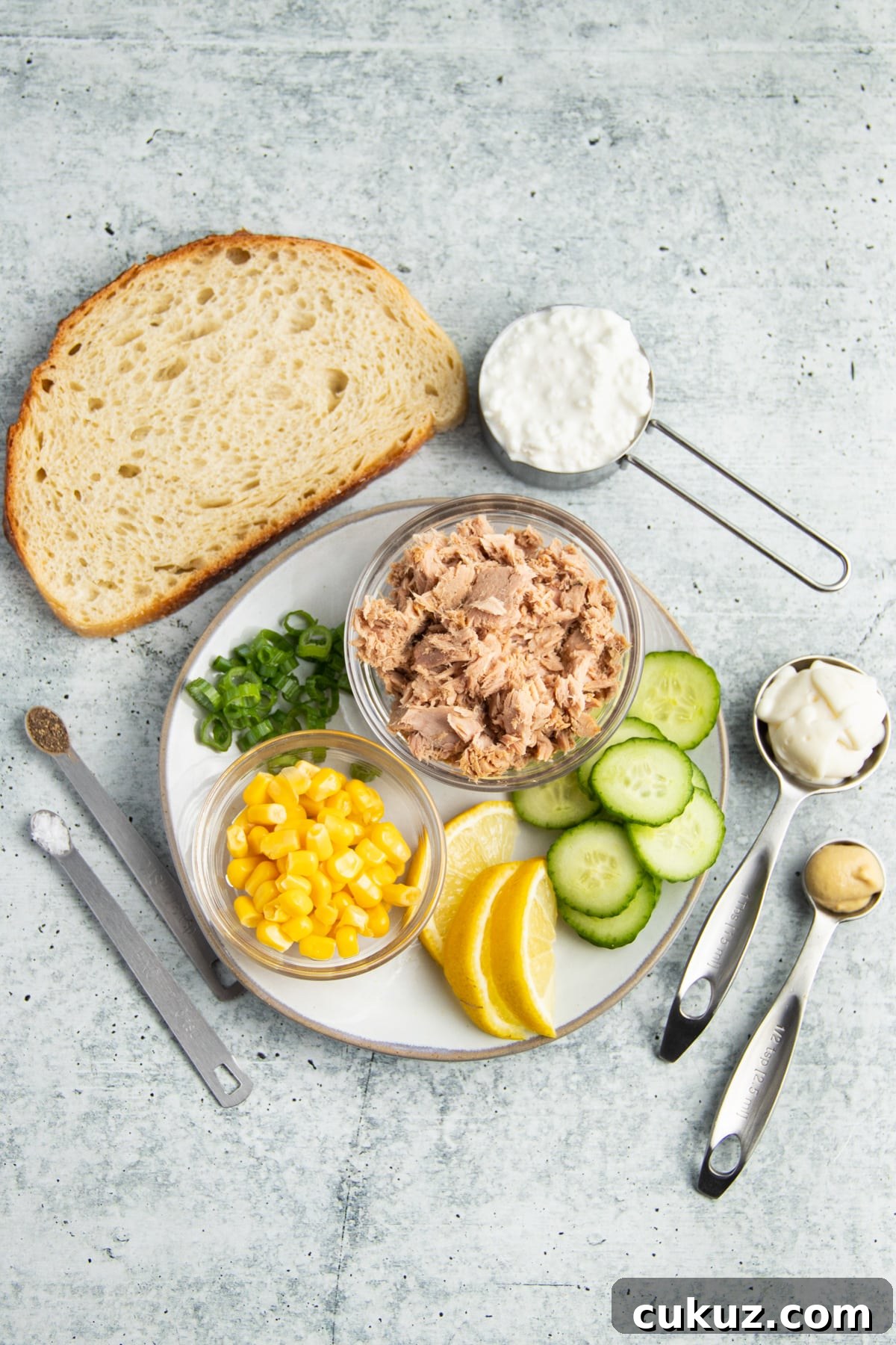 Picture of all ingredients for tuna and corn salad with cucumber cottage cheese toast. 