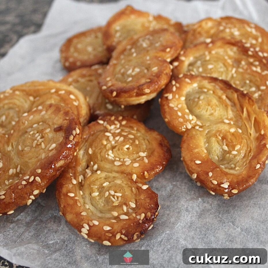 Easy Sesame Brown Sugar French Palmier Cookies, AKA Elephant Ears. These are a very easy to make crispy puff pastry cookie, filled with sesame seeds and brown sugar. Great for the holidays!