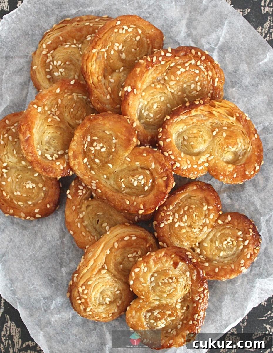 Easy Sesame Brown Sugar French Palmier Cookies, AKA Elephant Ears. These are a very easy to make crispy puff pastry cookie, filled with sesame seeds and brown sugar. Great for the holidays!