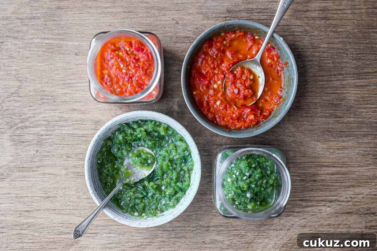 Two bowls and two jars of Middle Eastern Shatta Sauce. A red variety and green variety.