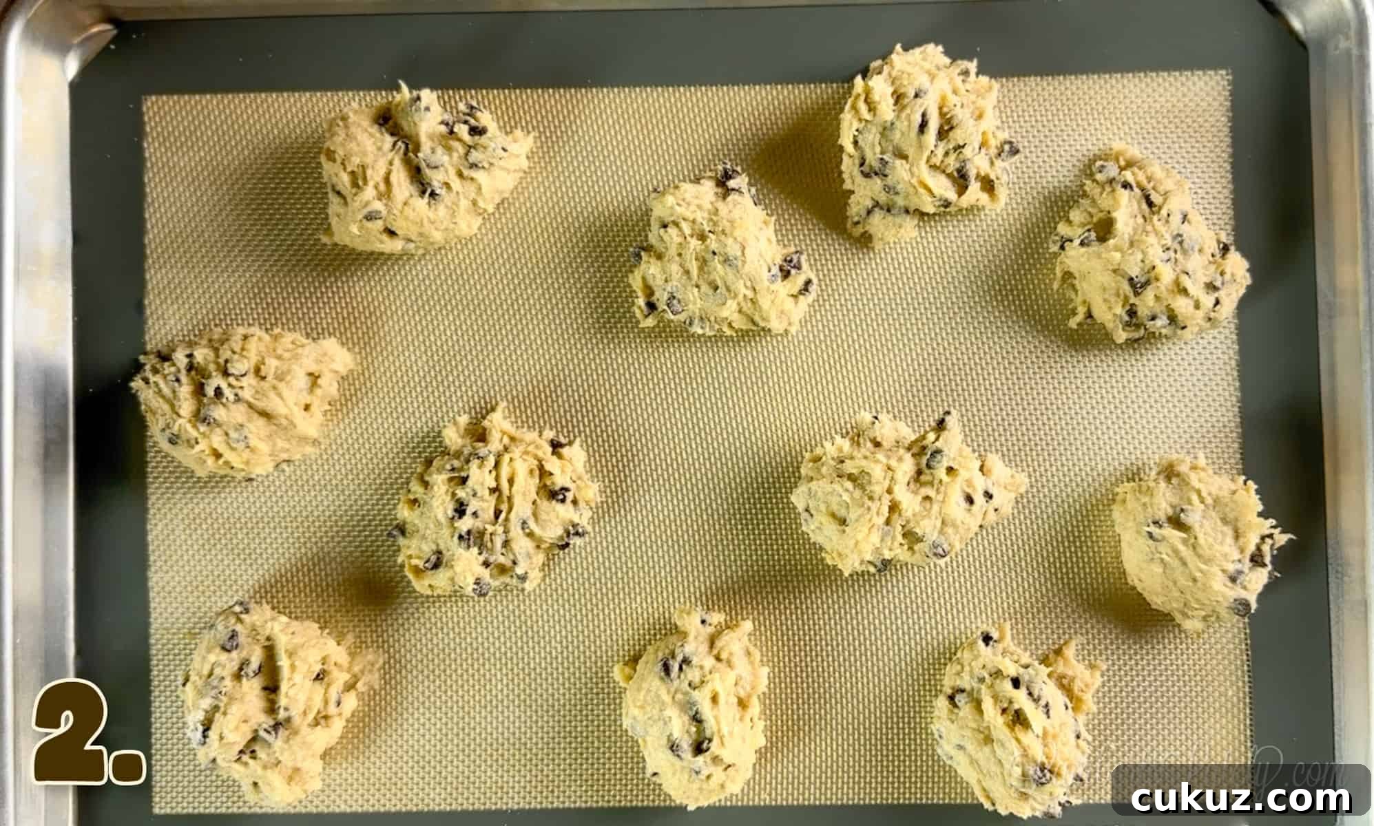 uncooked banana bread chocolate chip cookies on a baking sheet.