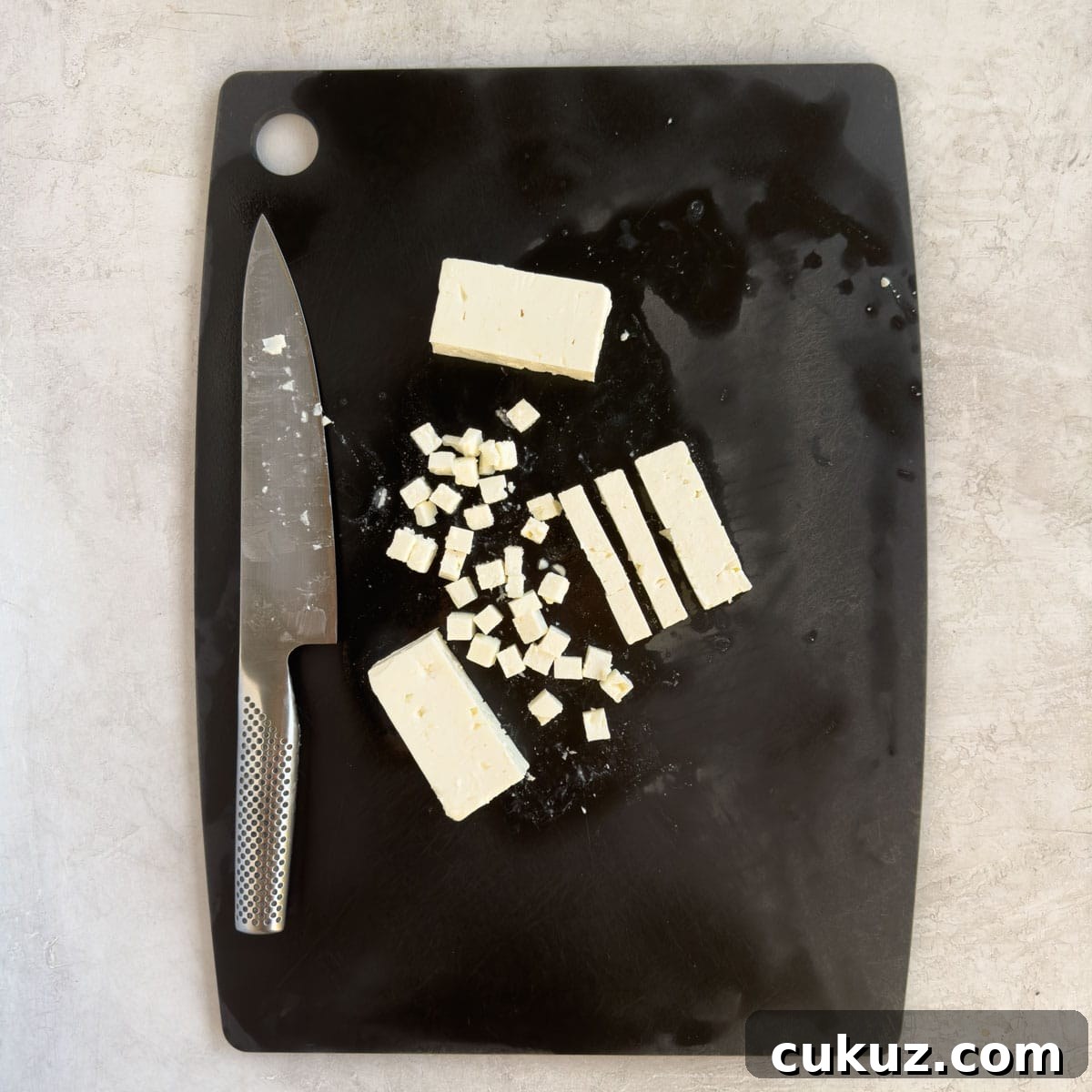 How to cut feta cheese into cubes for salad.