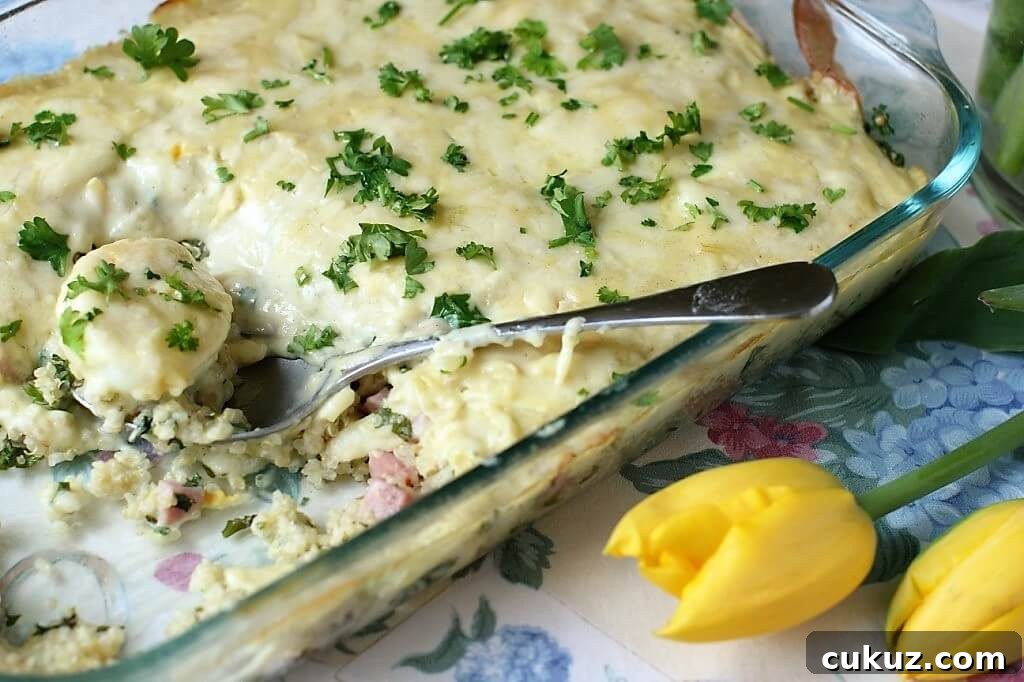 serving a spoonful of egg and quinoa bake