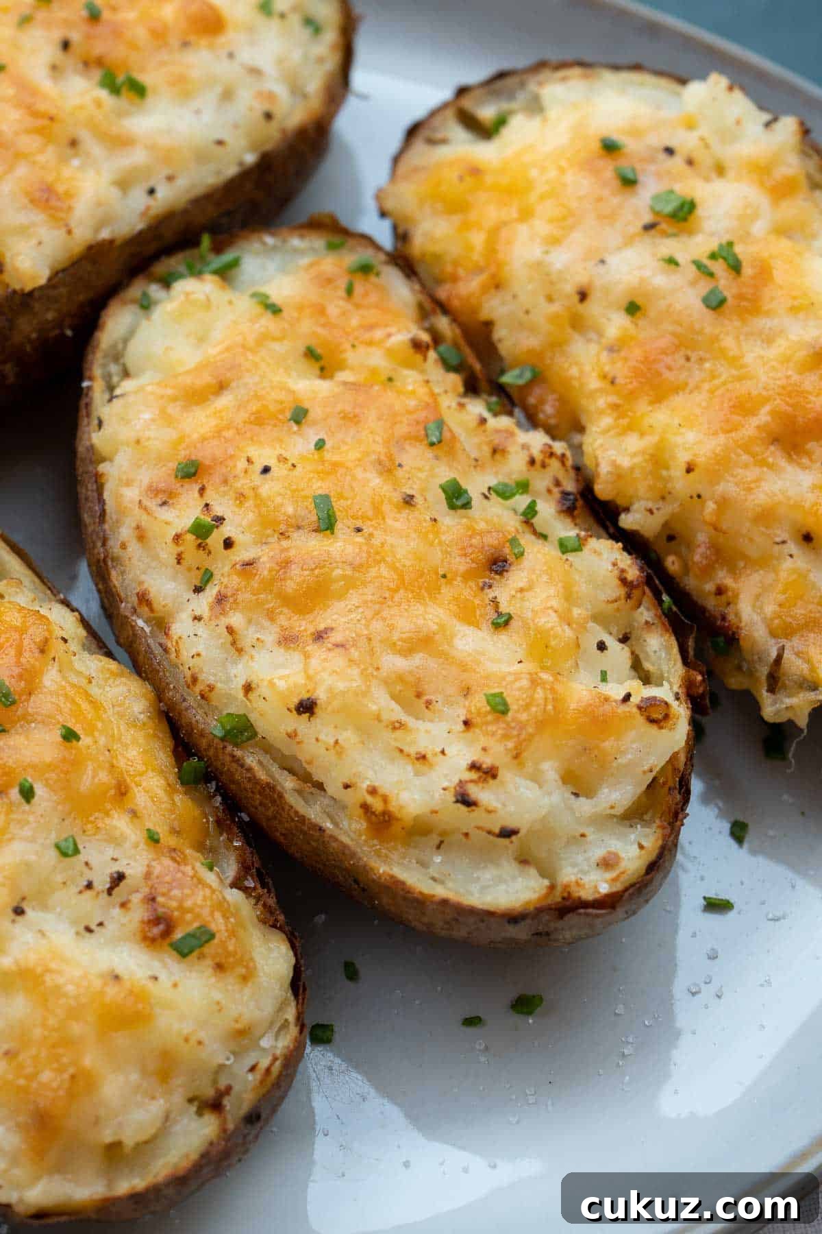 top twice baked potatoes with fresh herbs for a boost of flavor and presentation