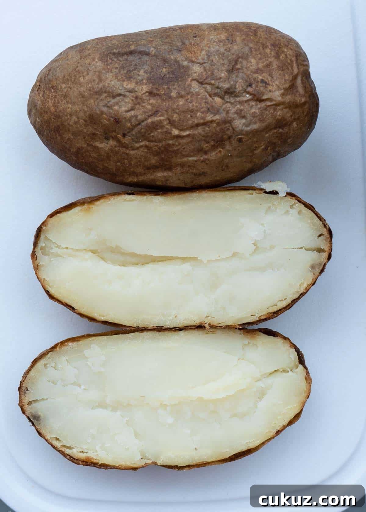 slice in half lengthwise for two separate potato halves.