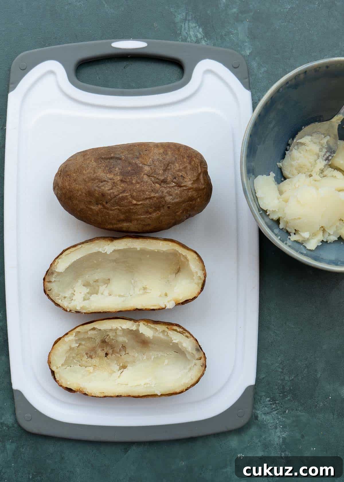 scoop filling into bowl, leaving 1/4 inch of potato flesh on the skin