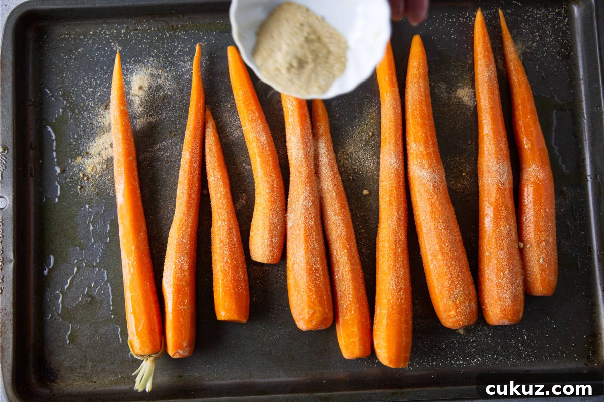 Seasoning the smoked carrots.