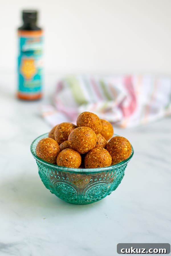 tangerine tropical energy bites in a blue bowl