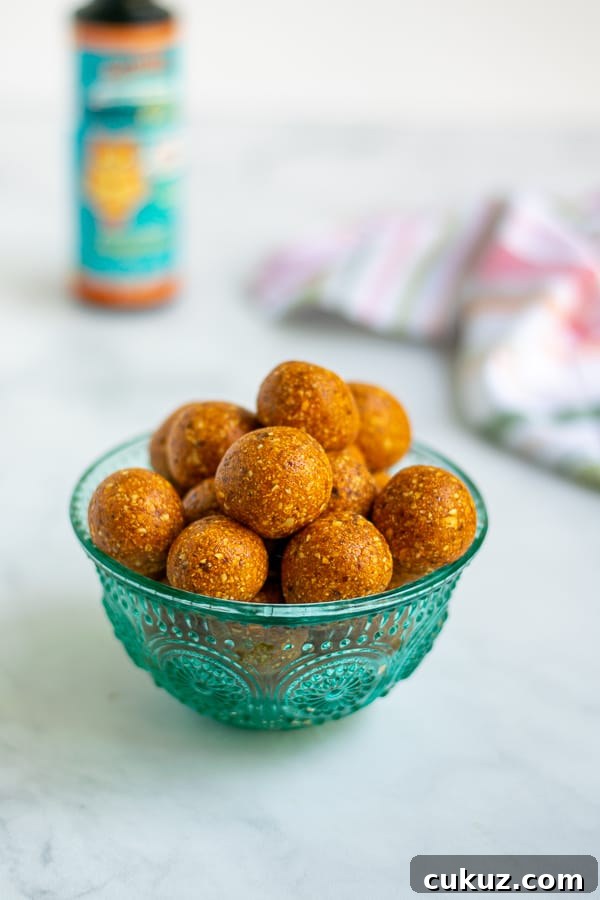 teal bowl overflowing with easy to make tropical energy bite snacks