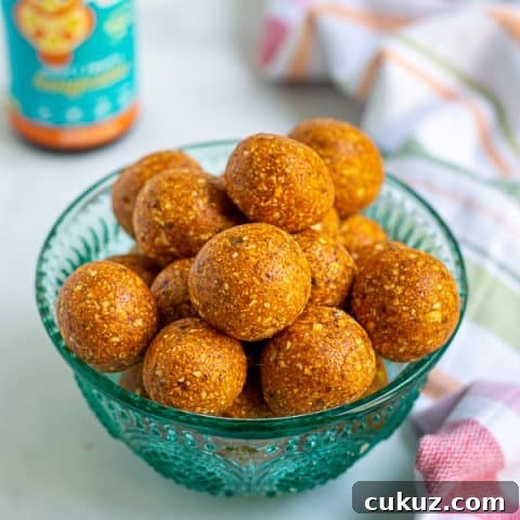 a blue bowl full of easy tropical energy bites