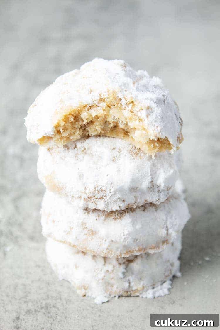 stack of keto snowballs cookies on countertop