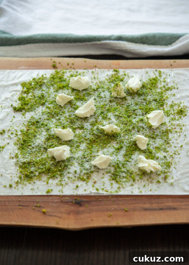 Ground pistachio, sugar and clotted cream on filo sheet.