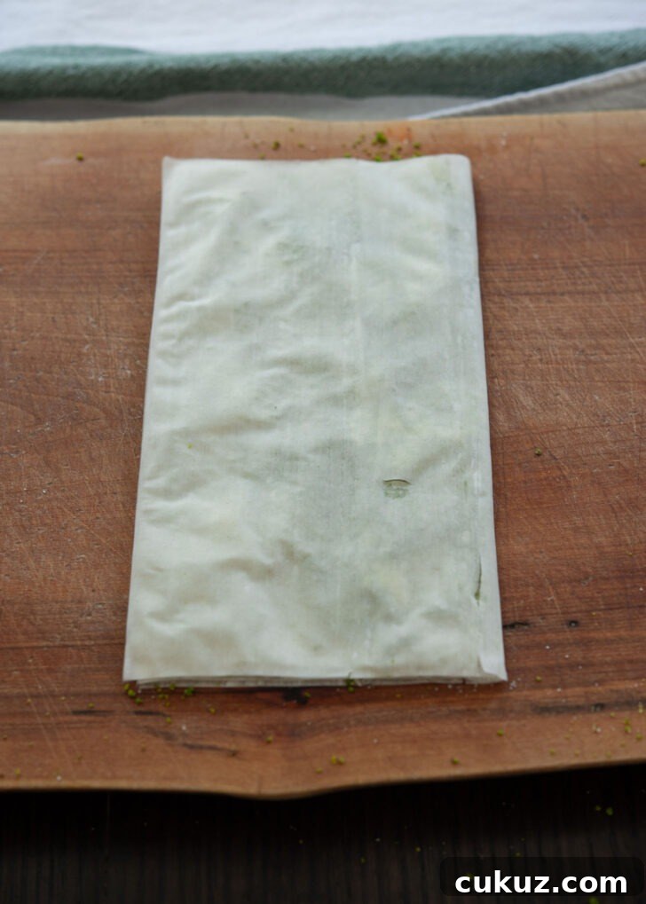 Filo pastry sheet folded to create envelope shape.