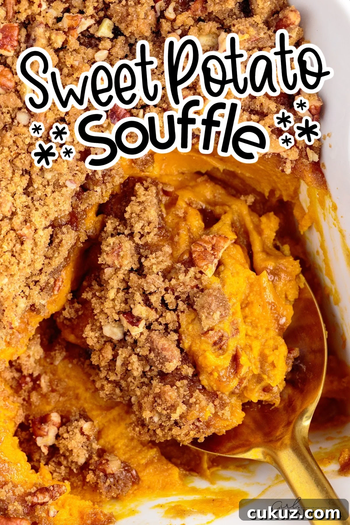 Fluffy Sweet Potato Souffle Recipe with Cinnamon and Marshmallows 2 Overhead view of Sweet Potato Souffle with a serving scooped on a spoon with text overlay.