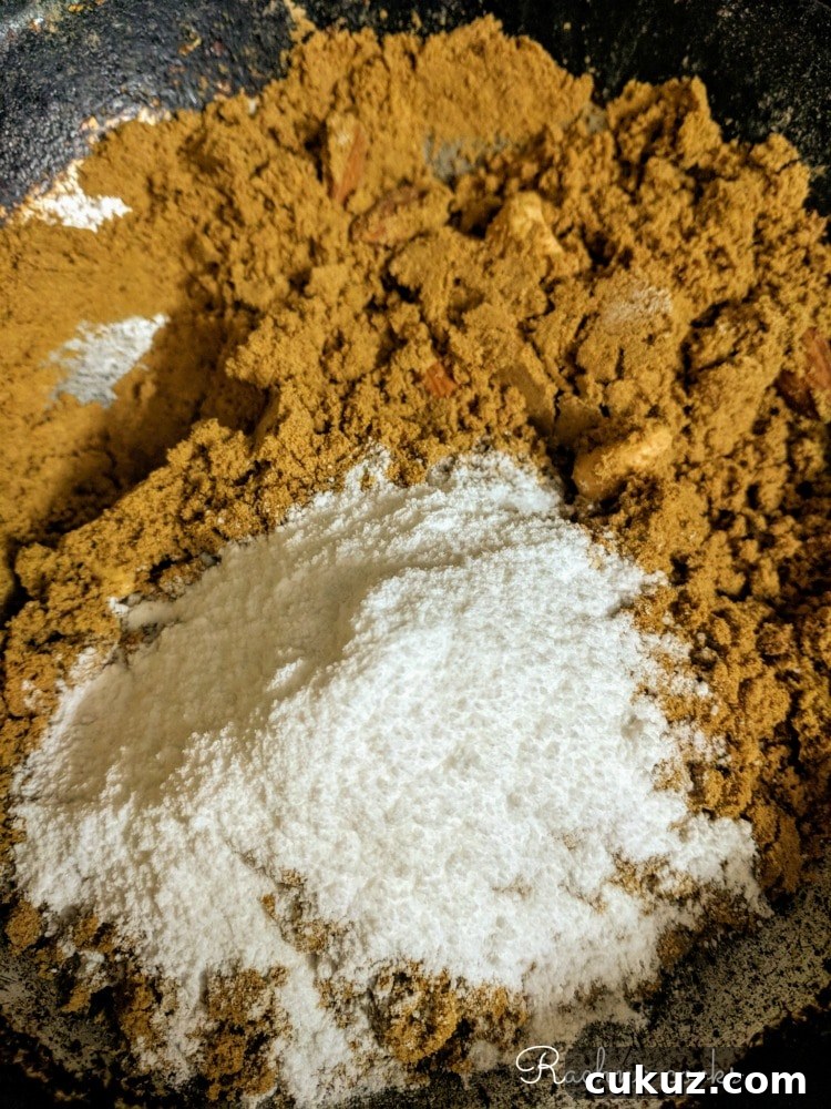Sugar added to the roasted panjiri once it has cooled down