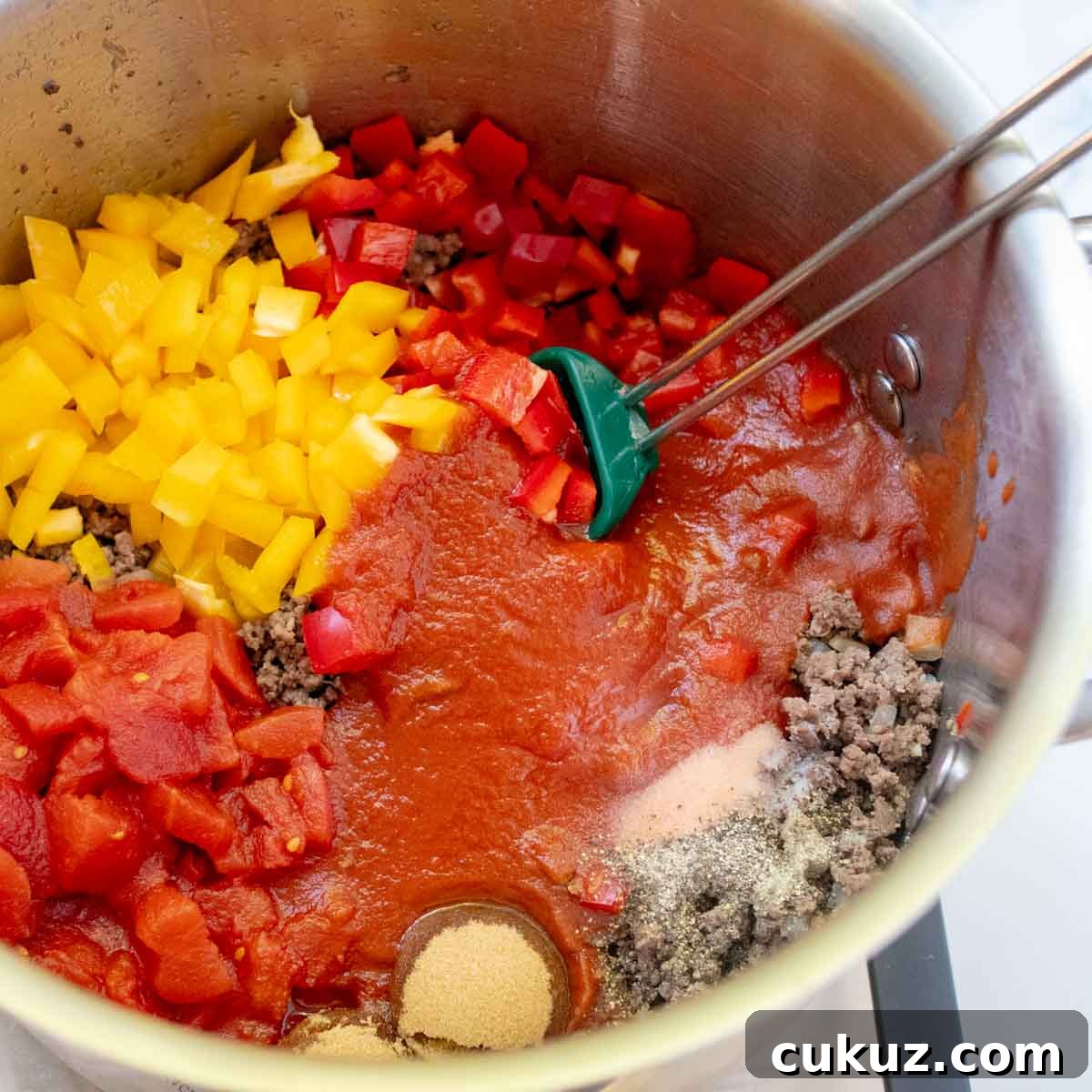 other ingredients added to the soup pot, like tomatoes, brown sugar, and peppers.