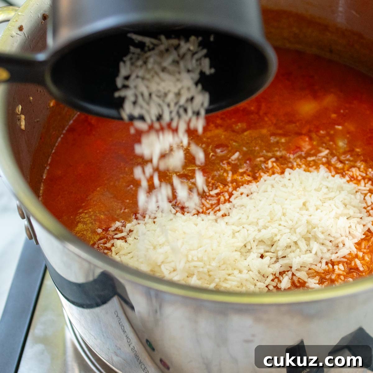 the rice being added to the soup.
