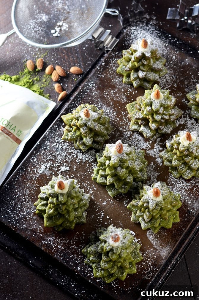 Matcha Cookie Christmas Tree Stacks. Buttery, sugary matcha green tea cookies make delicious Christmas gifts. Stack 'em up, sprinkle with powdered sugar, place an almond on top, and wrap them up in cellophane before passing them out as presents. | hostthetoast.com