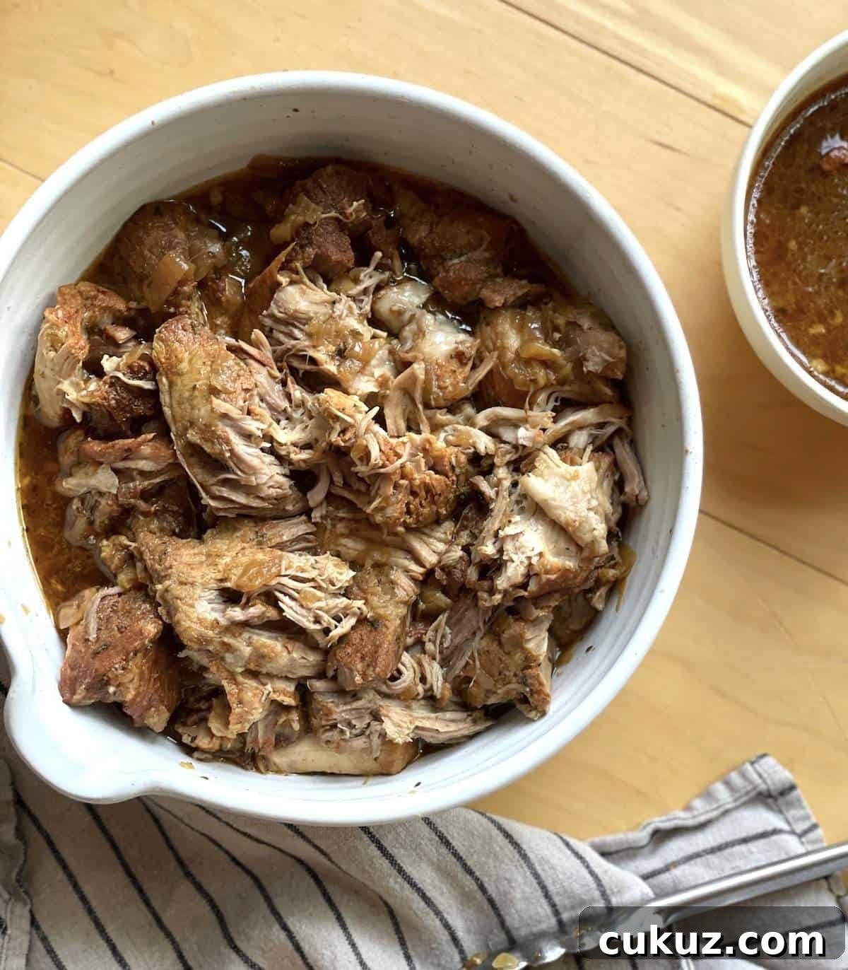 Instant Pot Country-Style Ribs with Tender, Fall-Off-the-Bone Results 6 A white bowl of instant pot country style pork ribs before being coated in sauce.
