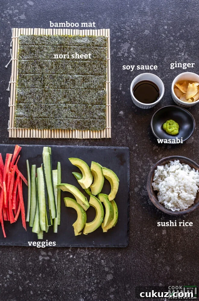all ingredients for making vegan sushi like nori, bamboo mat, veggies laid down on a board