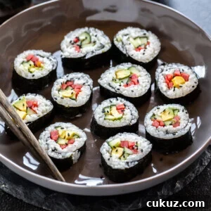 maki rolls filed with cucumber, avocado, carrots placed in a bowl