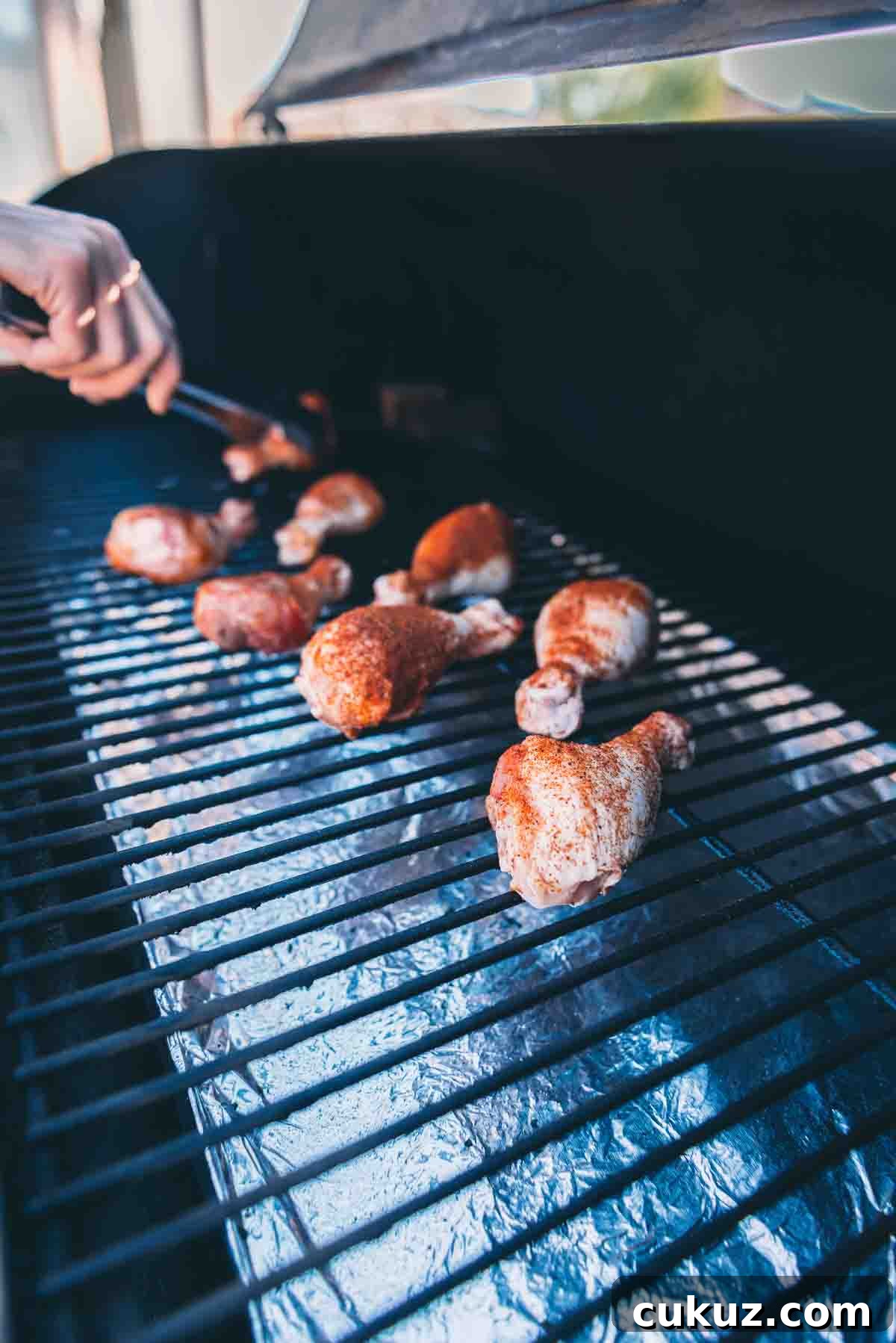 Raw legs going on the grill.