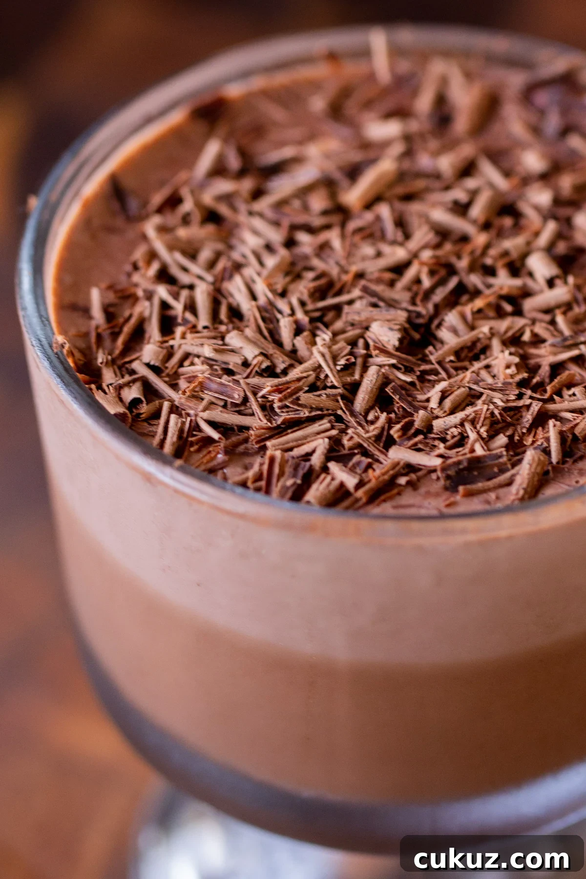 close-up of vegan chocolate pudding with chocolate shavings on top