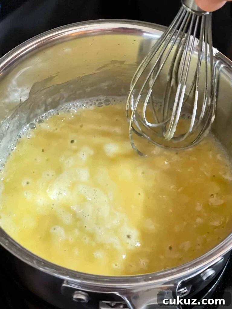 Flour whisked into the melted butter for the chicken and wild rice soup milk mixture.